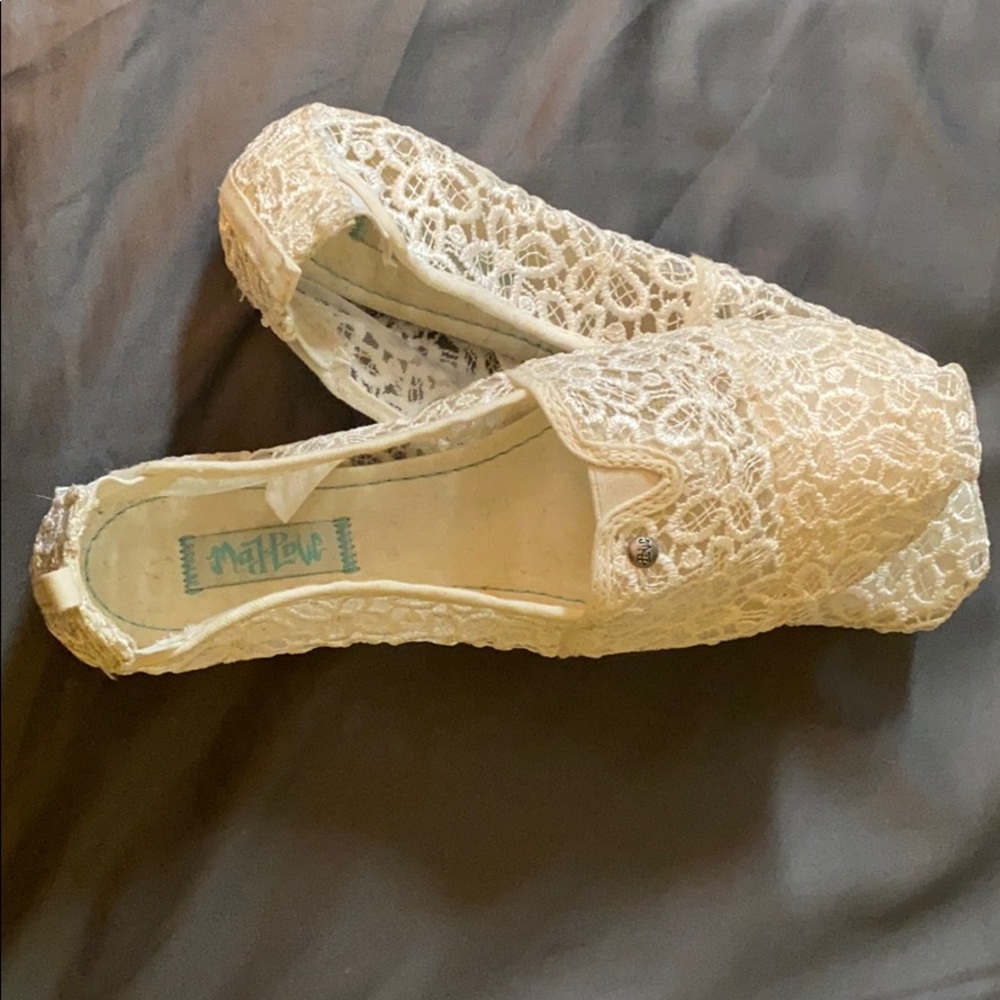 Lacy white slip on shoes